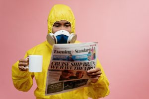 A man wearing a yellow ppe full body suit