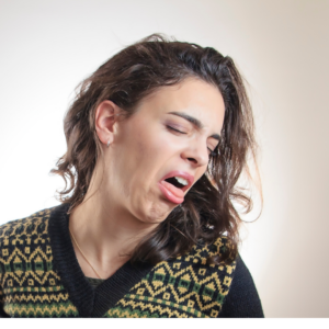 a woman making a disgusted face