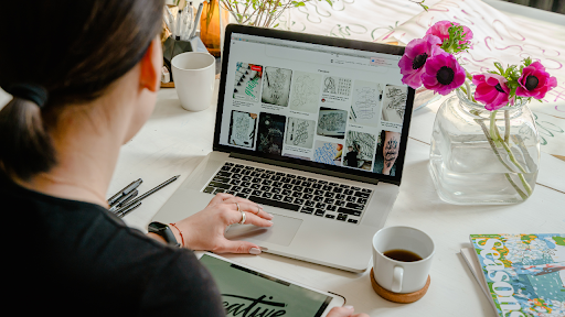 designer-non-profit-website female with pony tail designer working on a non profit website design